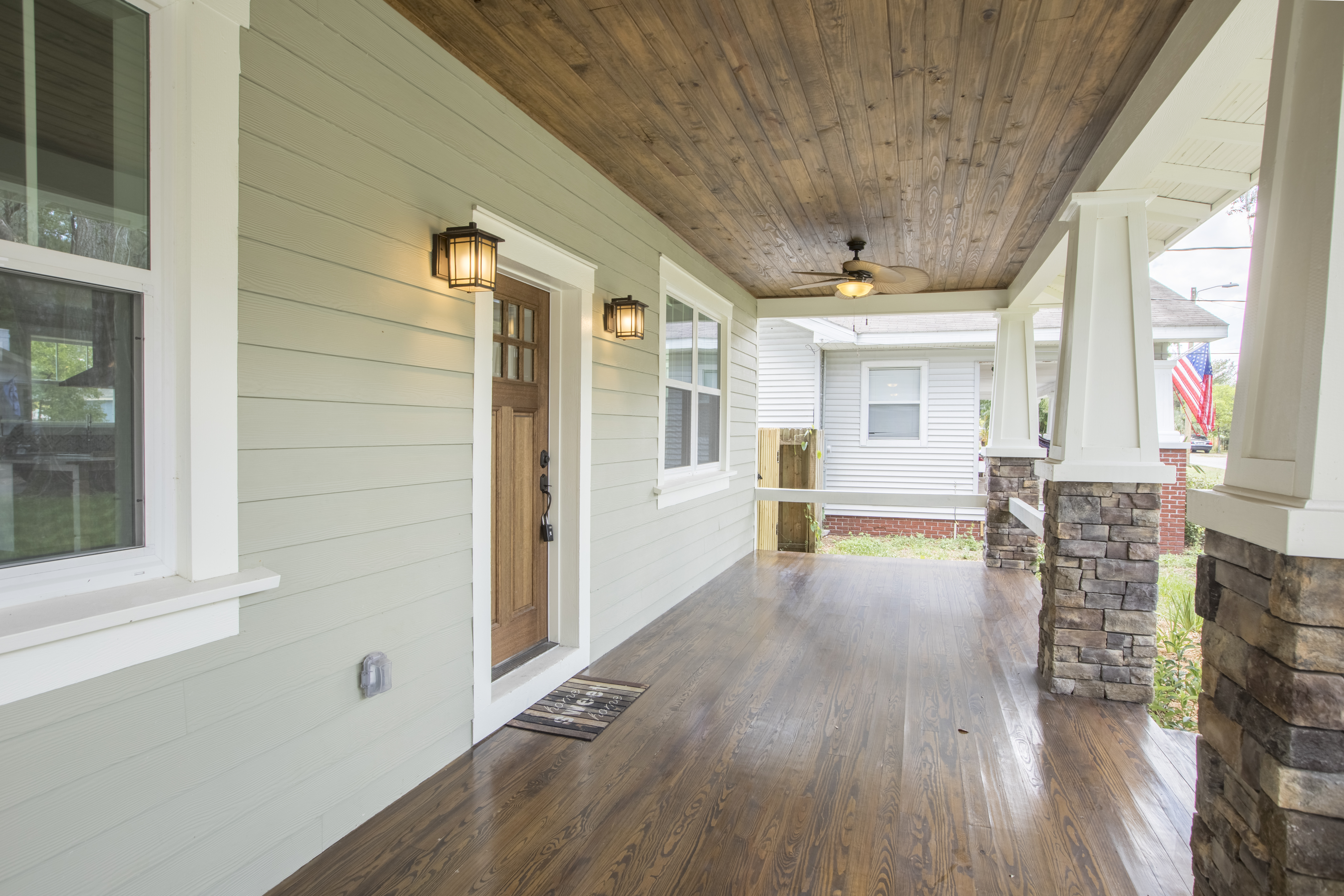 side angle of front porch with wooden flooring